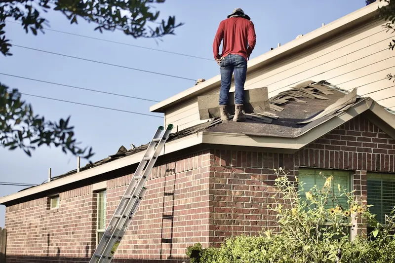 Professional roofer working on a residential roof in Lonelyville